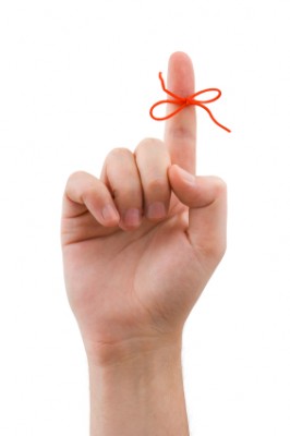 Red bow on finger Red bow on finger